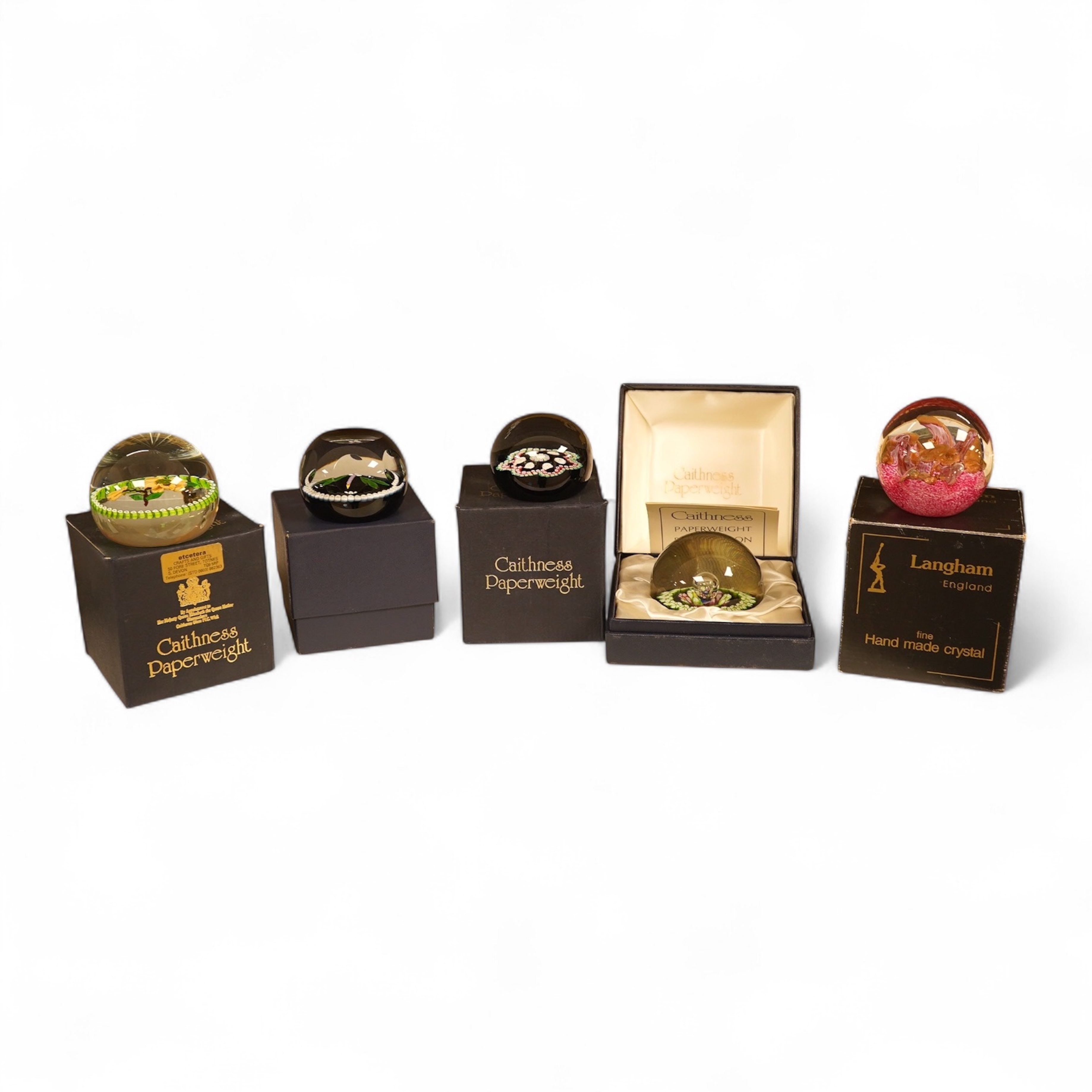 Four Caithness boxed paperweights to include ‘Garland’ and boxed Langham paperweight